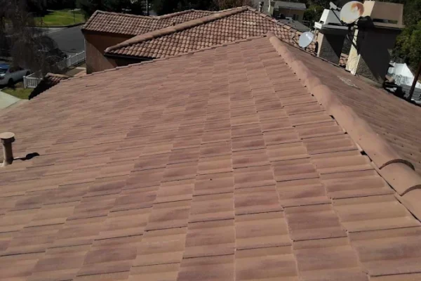 Concrete tile roof after replacement, viewed along the ridge